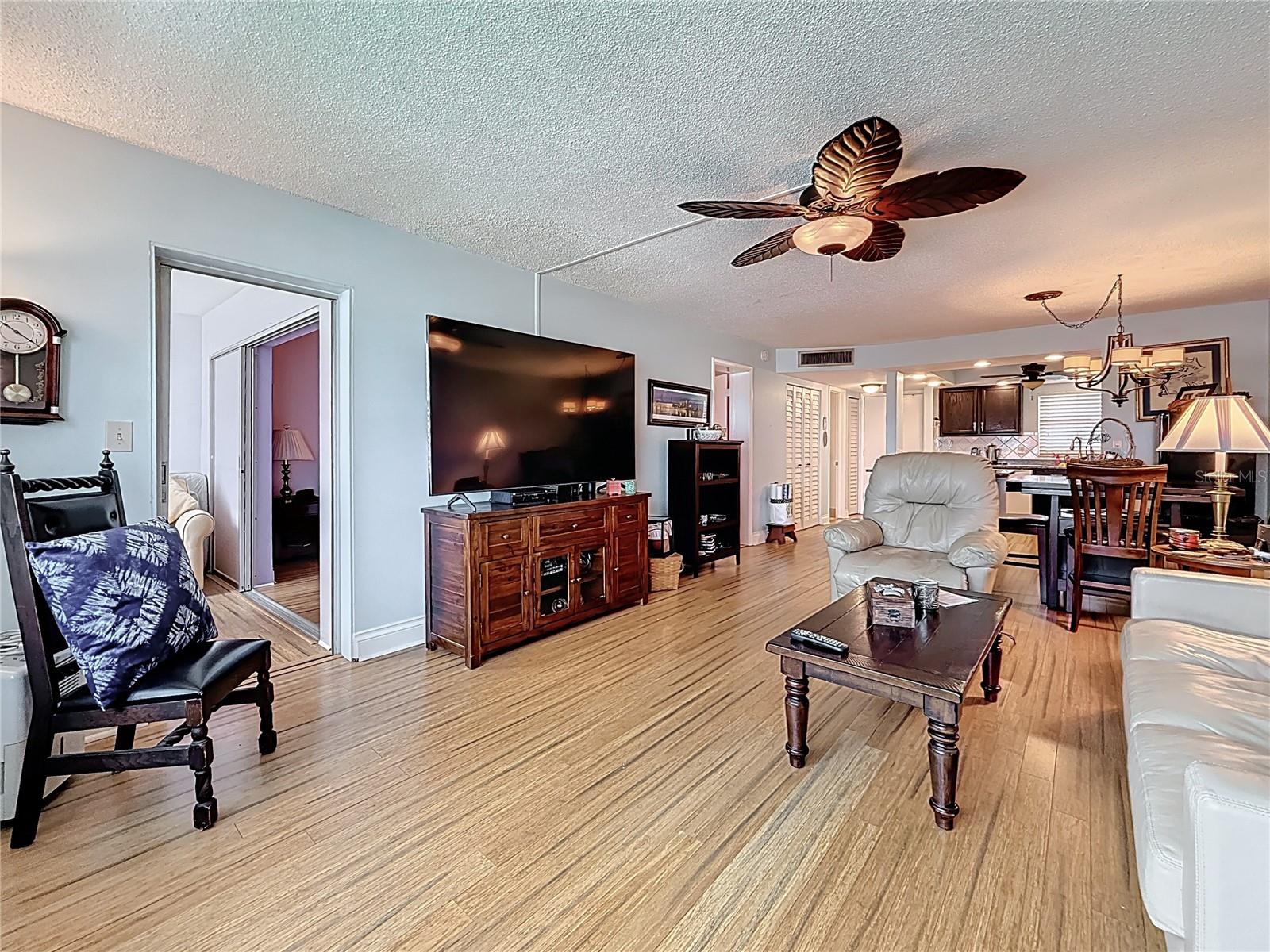 This pictures shows the living space looking back from the back of the condo.  This living space can be set up any way you would like.  Notice the doorway that leads to the Florida room.