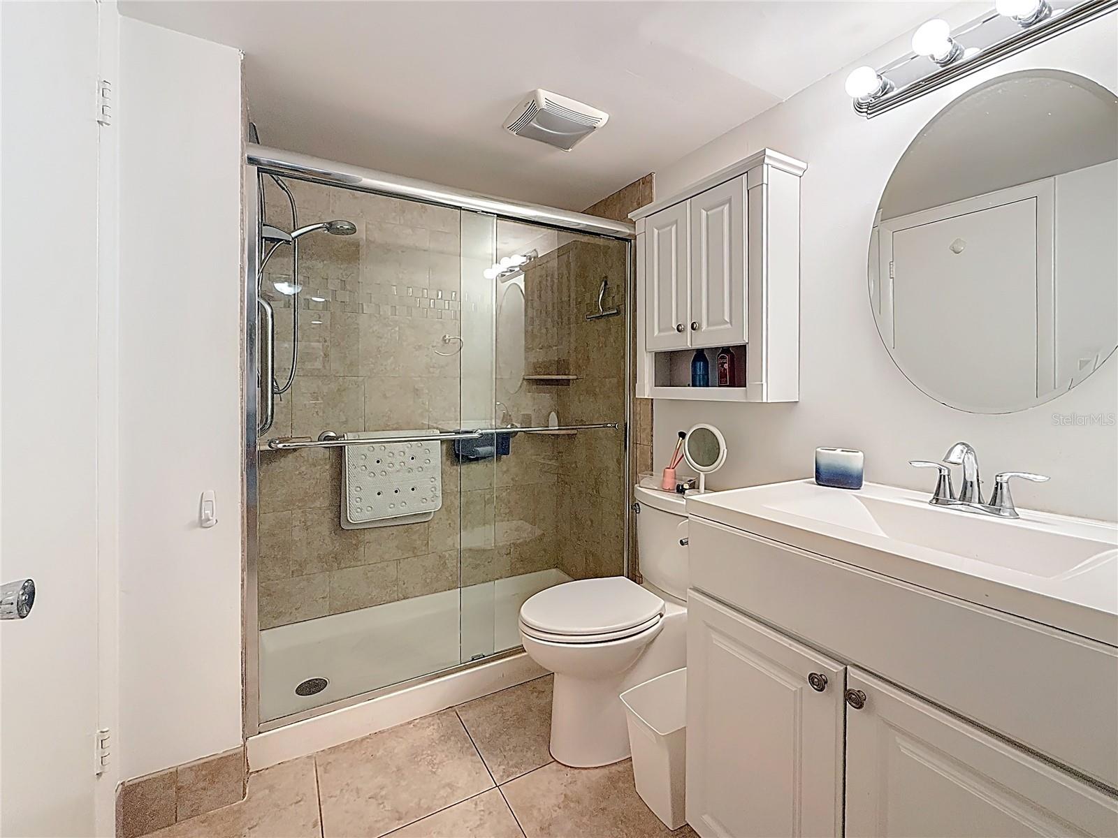 Updated bathroom with a nice sized shower.  There is an entrance from both the primary bedroom and the hallway byt the kitchen