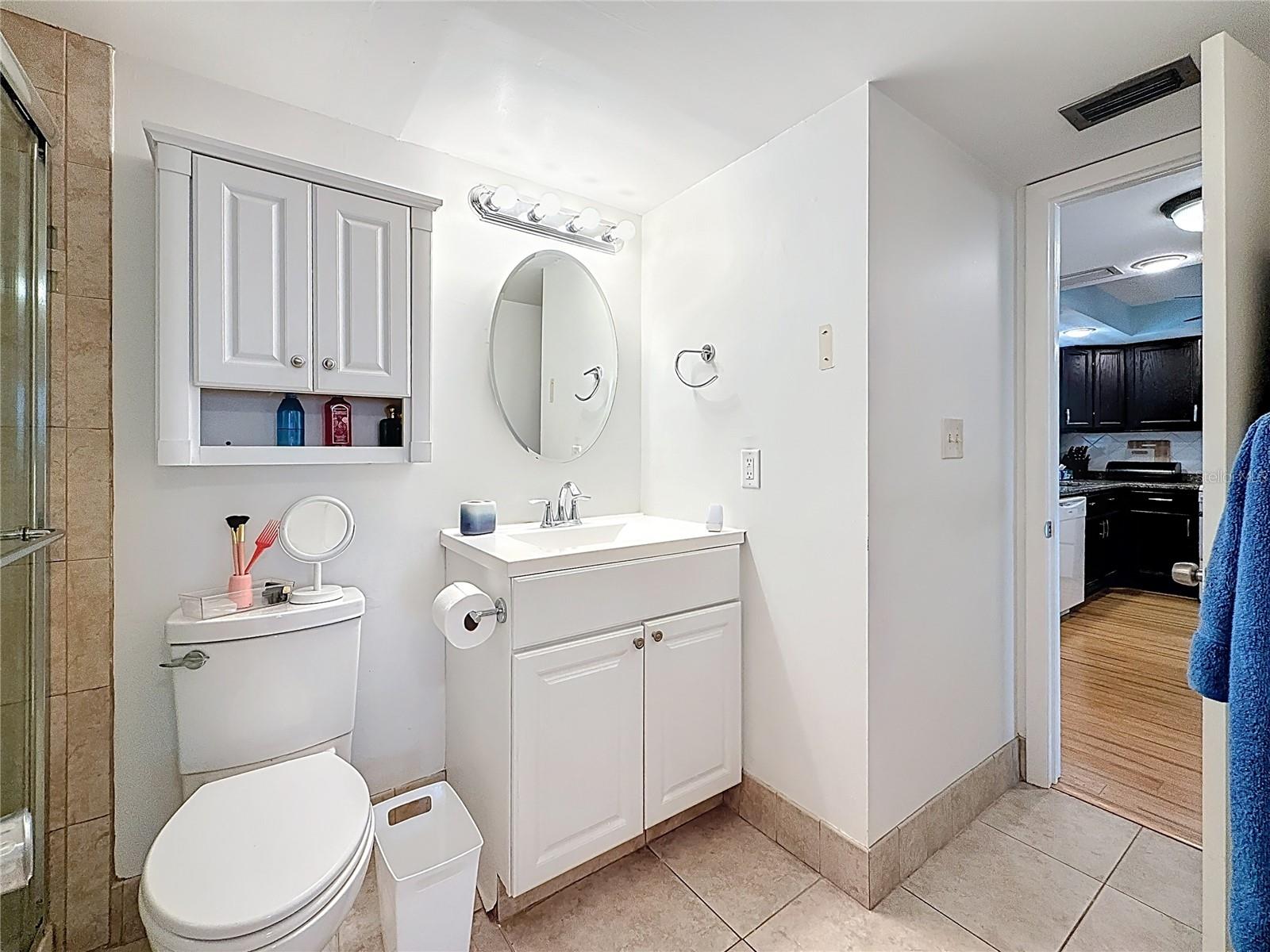 This shows the other entrance off the kitchen into this nicely updated bathroom