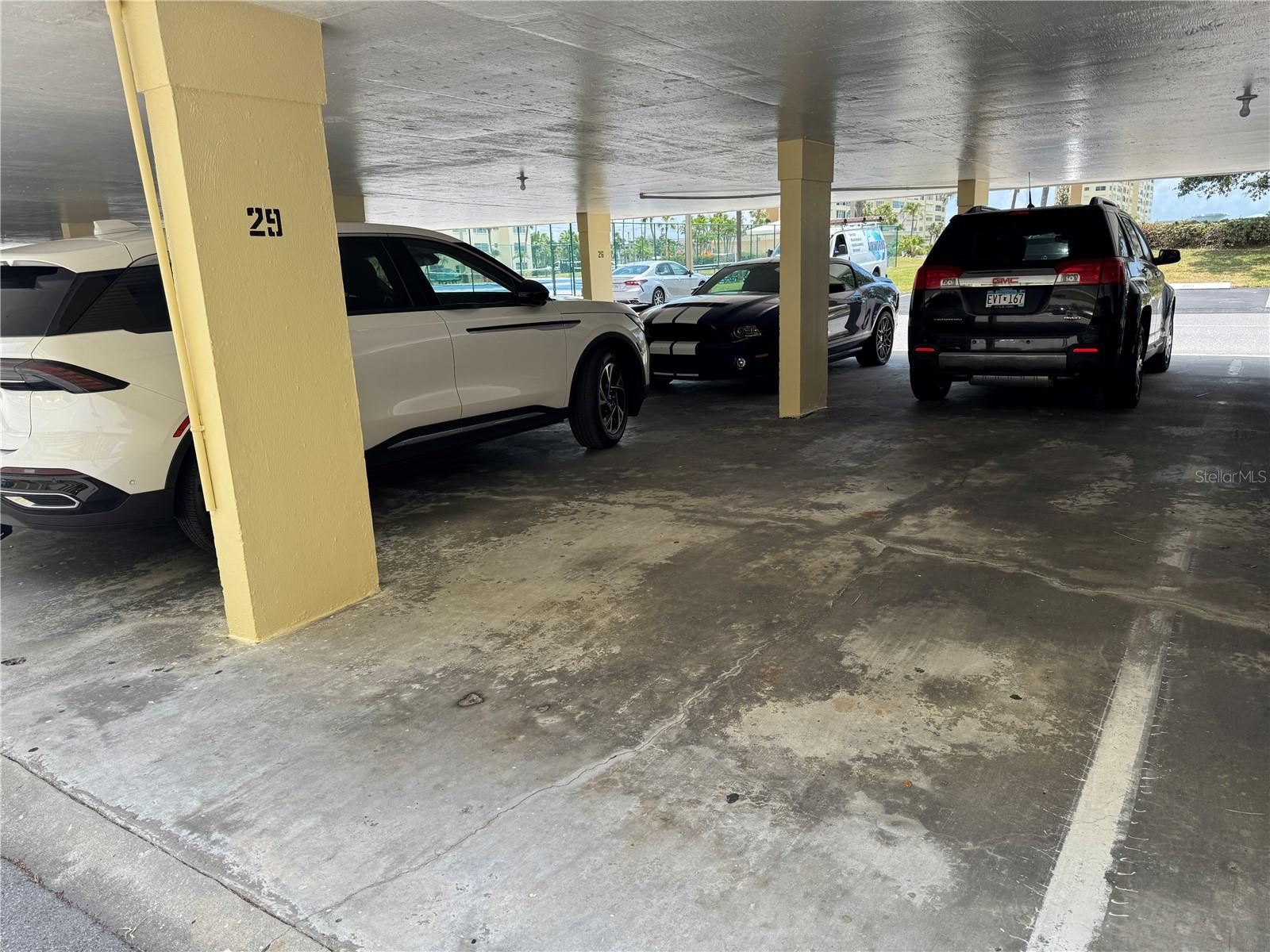 Covered parking space that conveys with this unit and is located right in front of the building