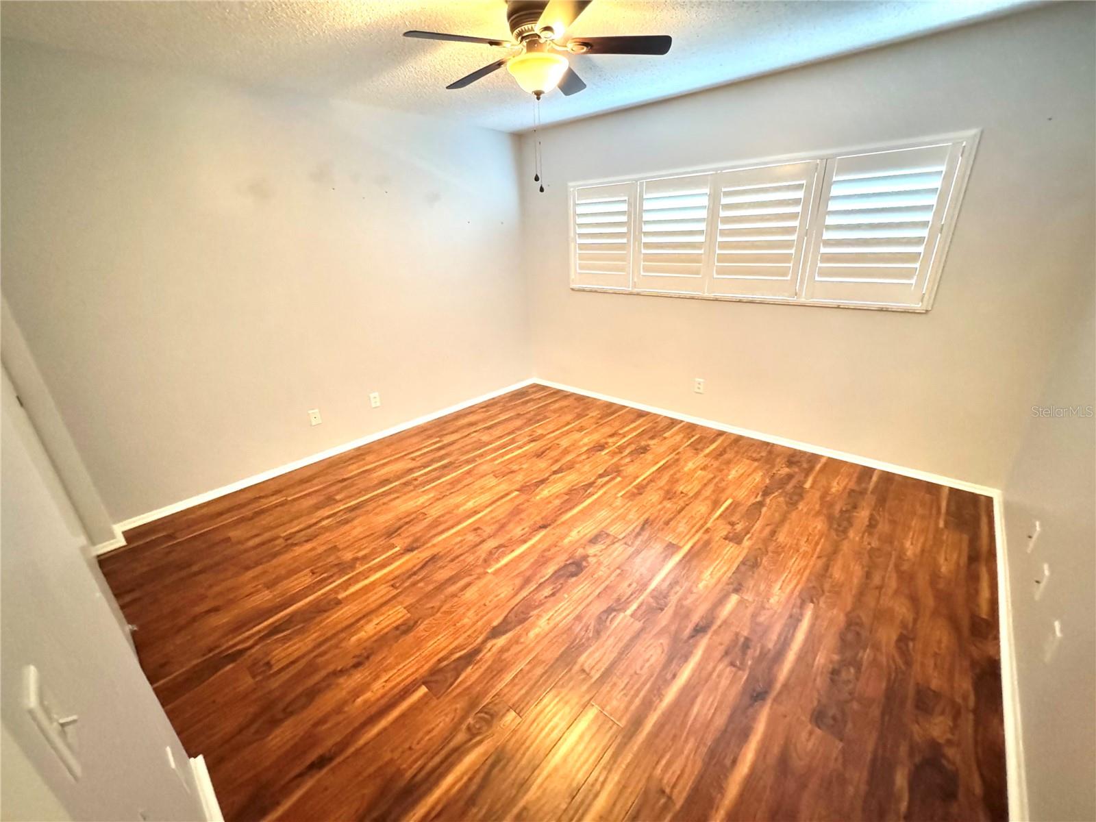 Guest bedroom with plantation shutters