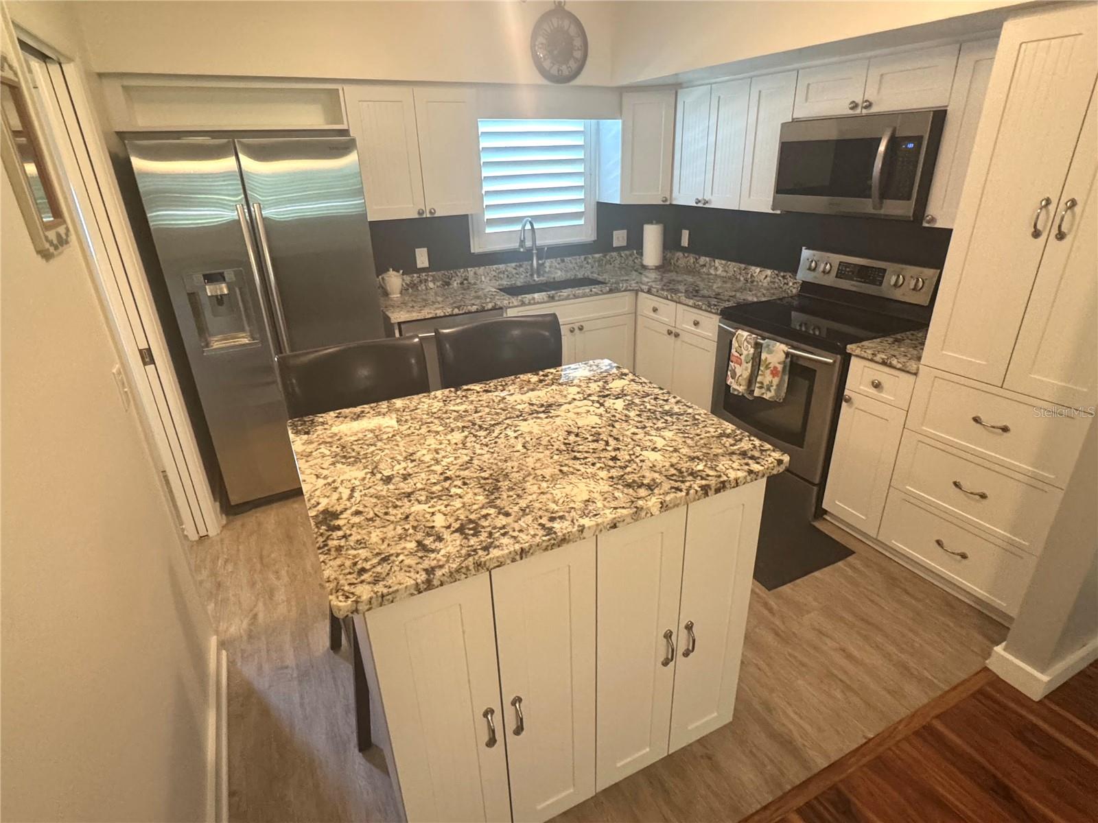 Updated shaker cabinets and stainless appliances