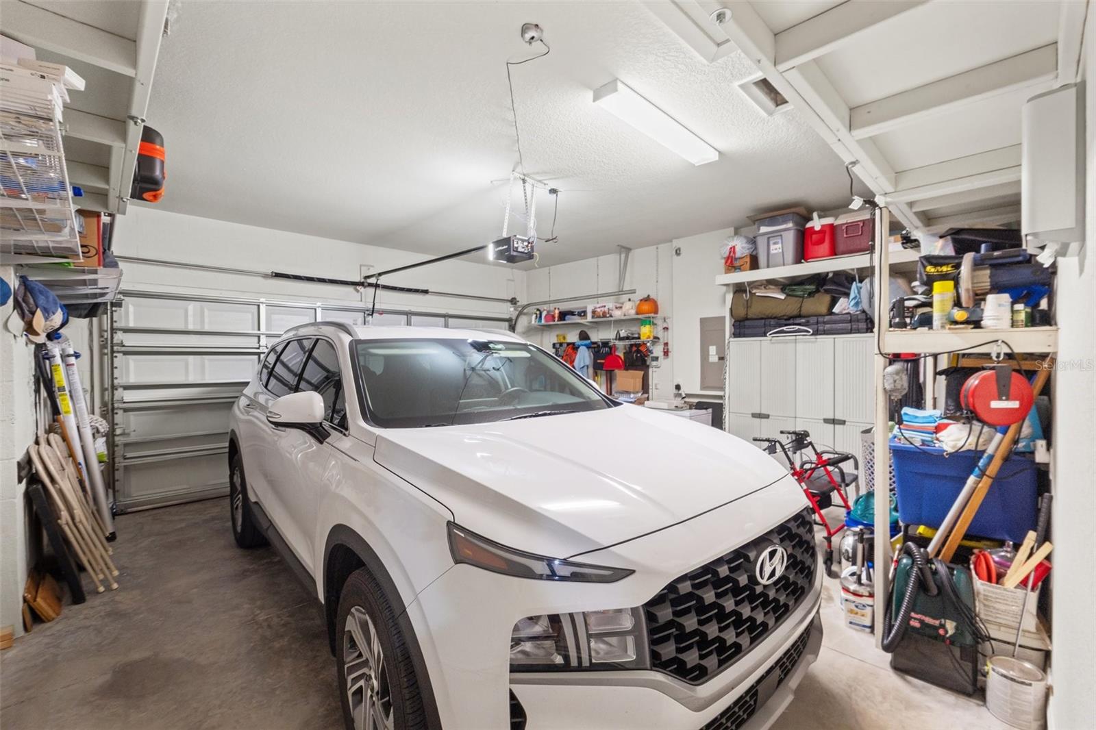 2 Car Garage, tons of storage space - and yes, the storage stays. (I'm jealous!)