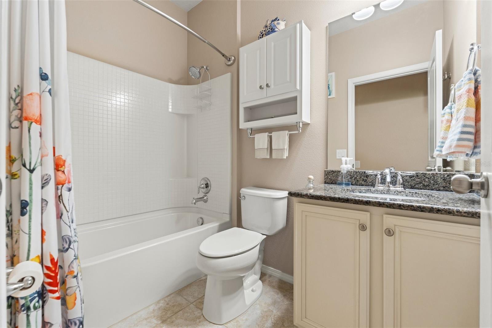 The Main Bath is between the 2 Secondary Bedrooms.