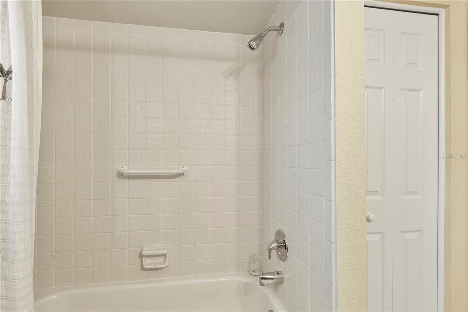 Guest bathroom with linen closet