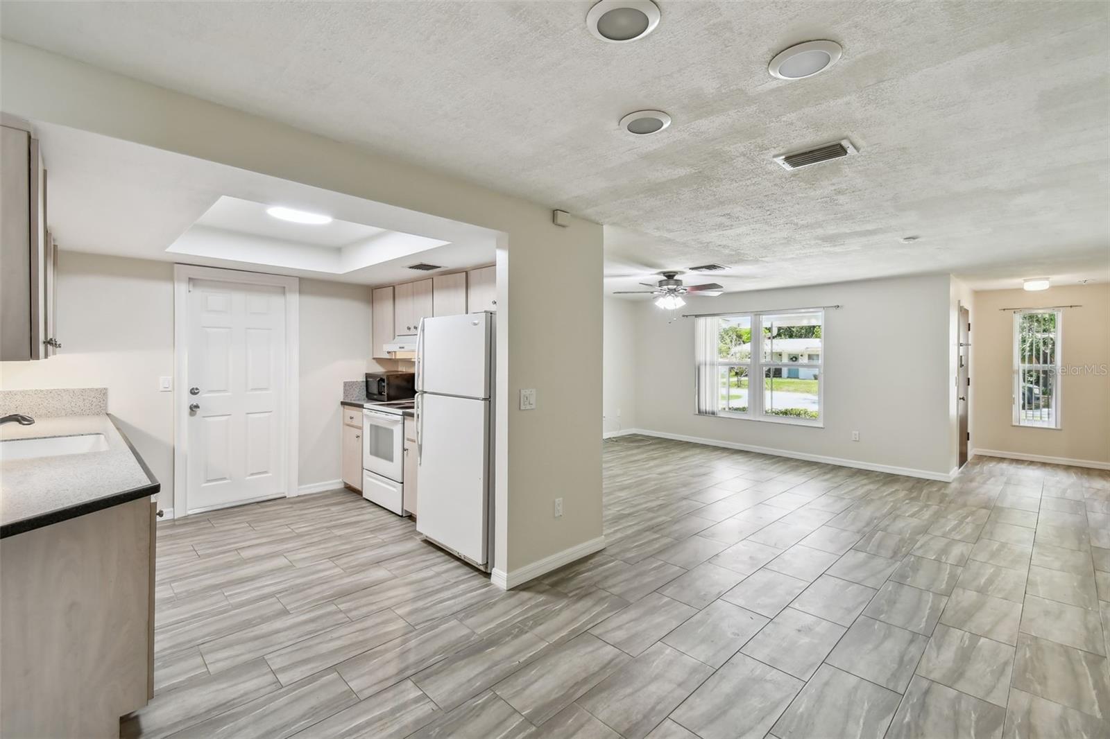 View from dining area to kitchen and living room