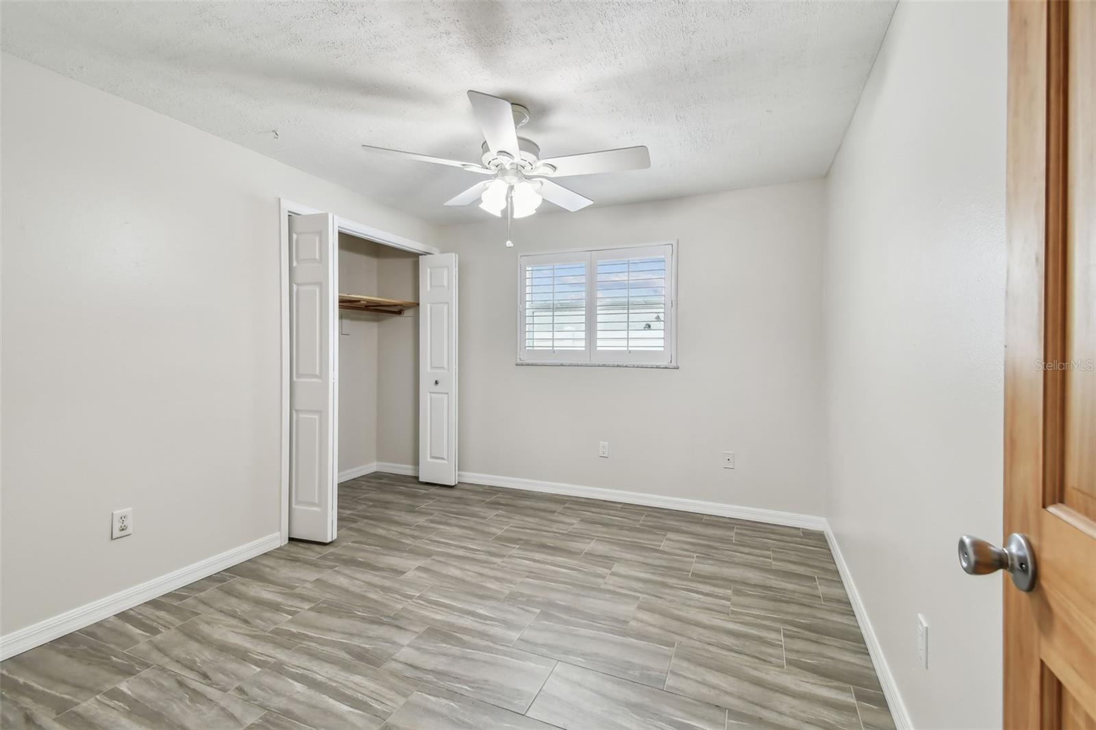 Second bedroom with updated window and shutters