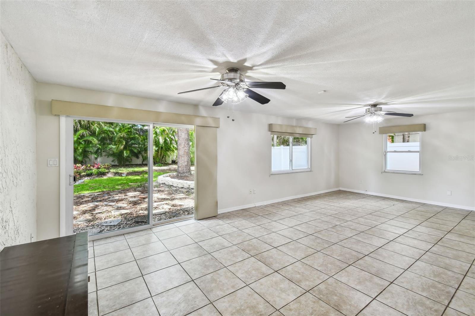 Large bonus room with slider out to lovely backyard