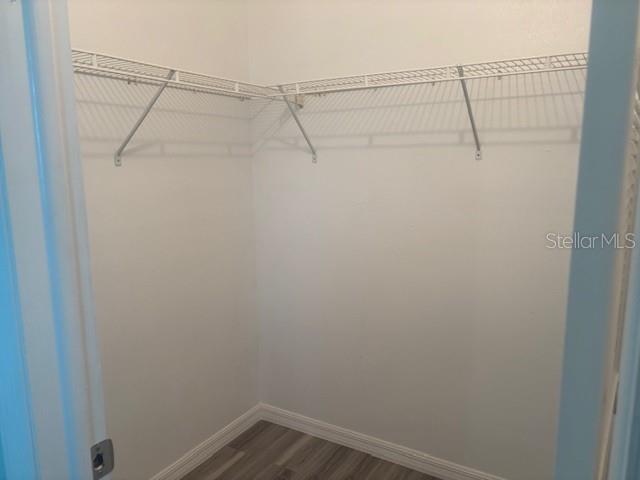 Primary bedroom walk in closet