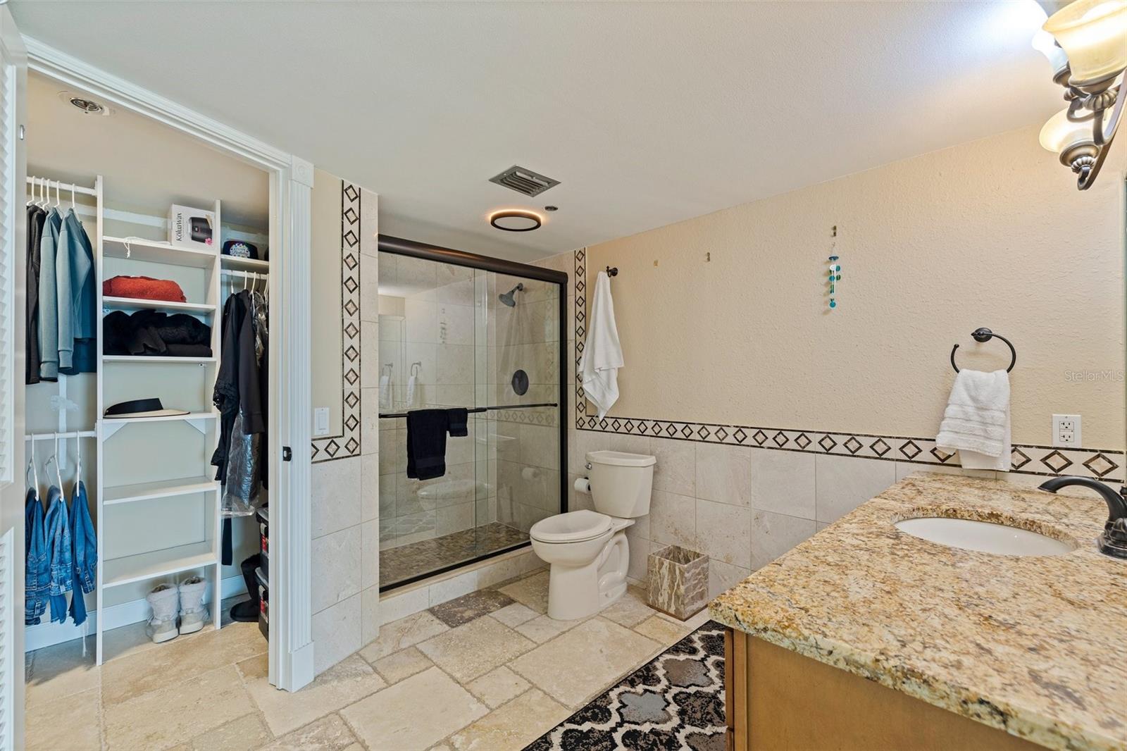 Primary bedroom walk-in closet