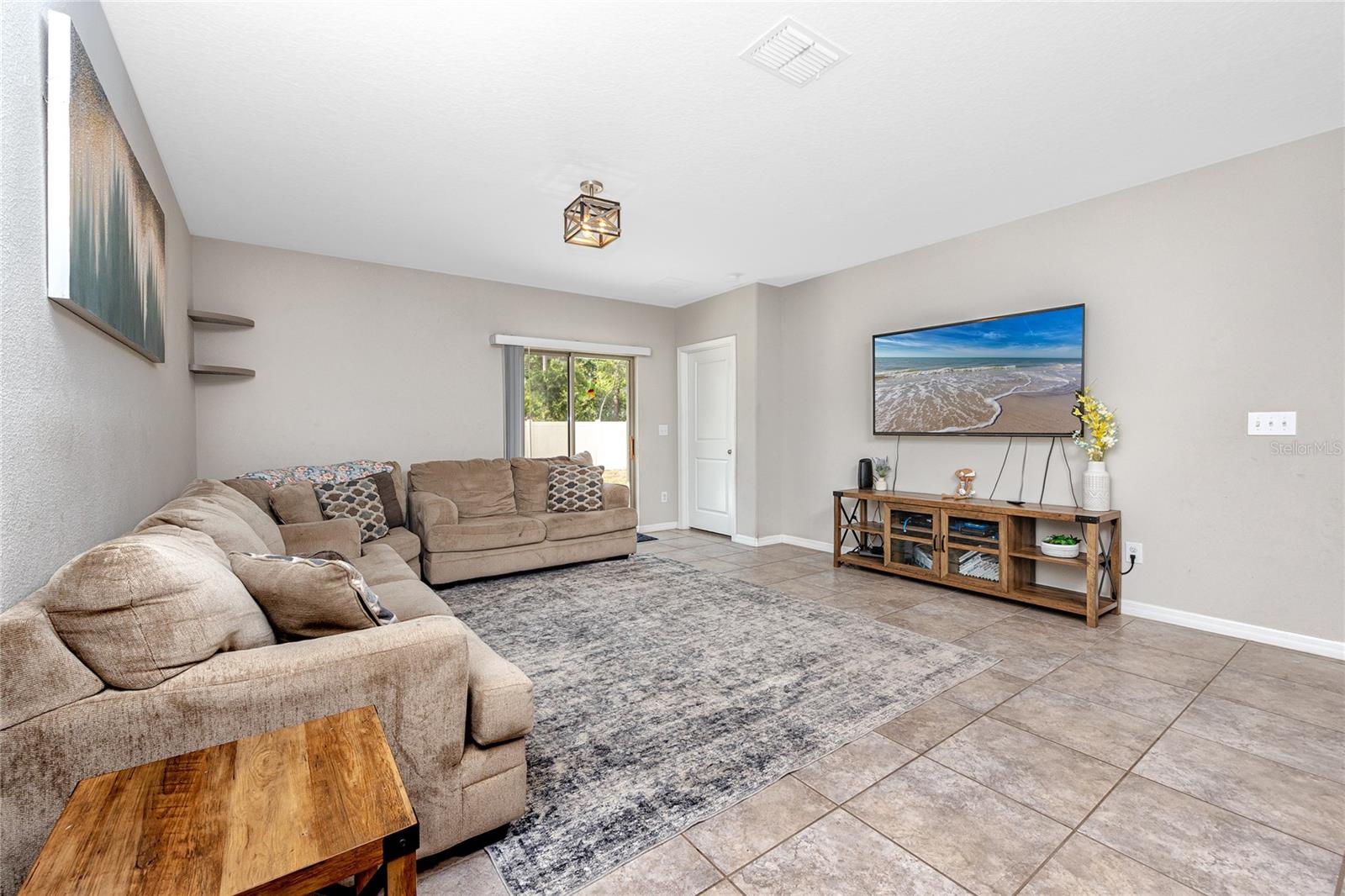 Living Room 7034 Emerald Spring Lp, New Port Richey, FL 34653 at Copperspring