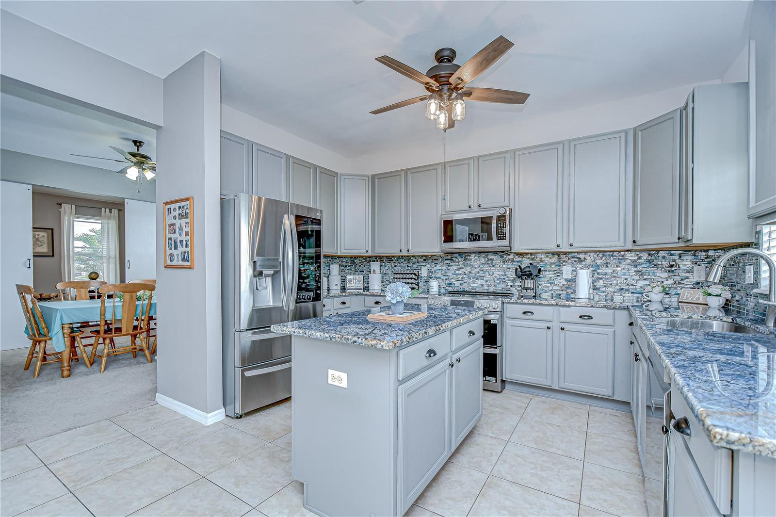New stainless appliances including a dishwasher (2025), range (2024), microwave (2022), and refrigerator and sink (2021)!