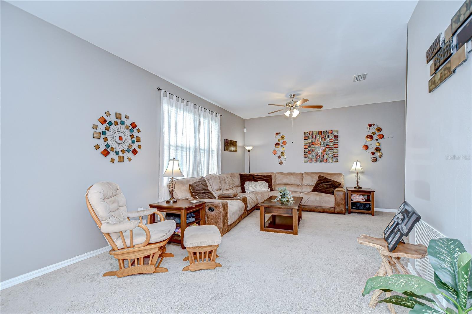 The spacious family room is filled with natural light from the large picture window!