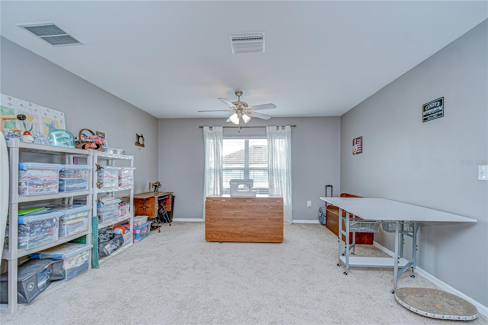 The large loft space is perfect for a playroom, home office, or media area.