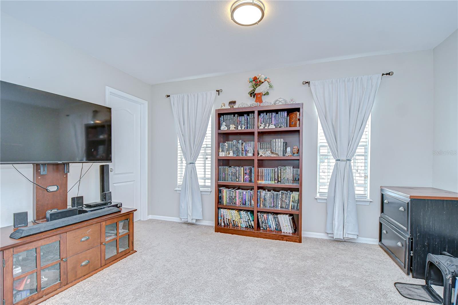 The primary suite offers a spacious sitting area nearby the large walk-in closet!