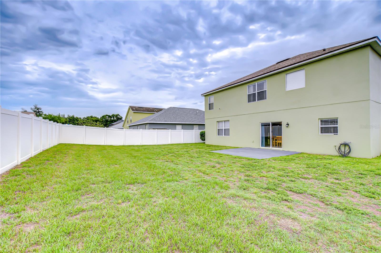 This fully fenced backyard offers plenty of space to create your own outdoor retreat!