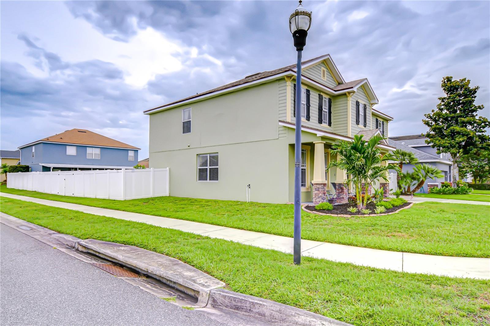 Perched on a corner lot, this home stands out with space and style!