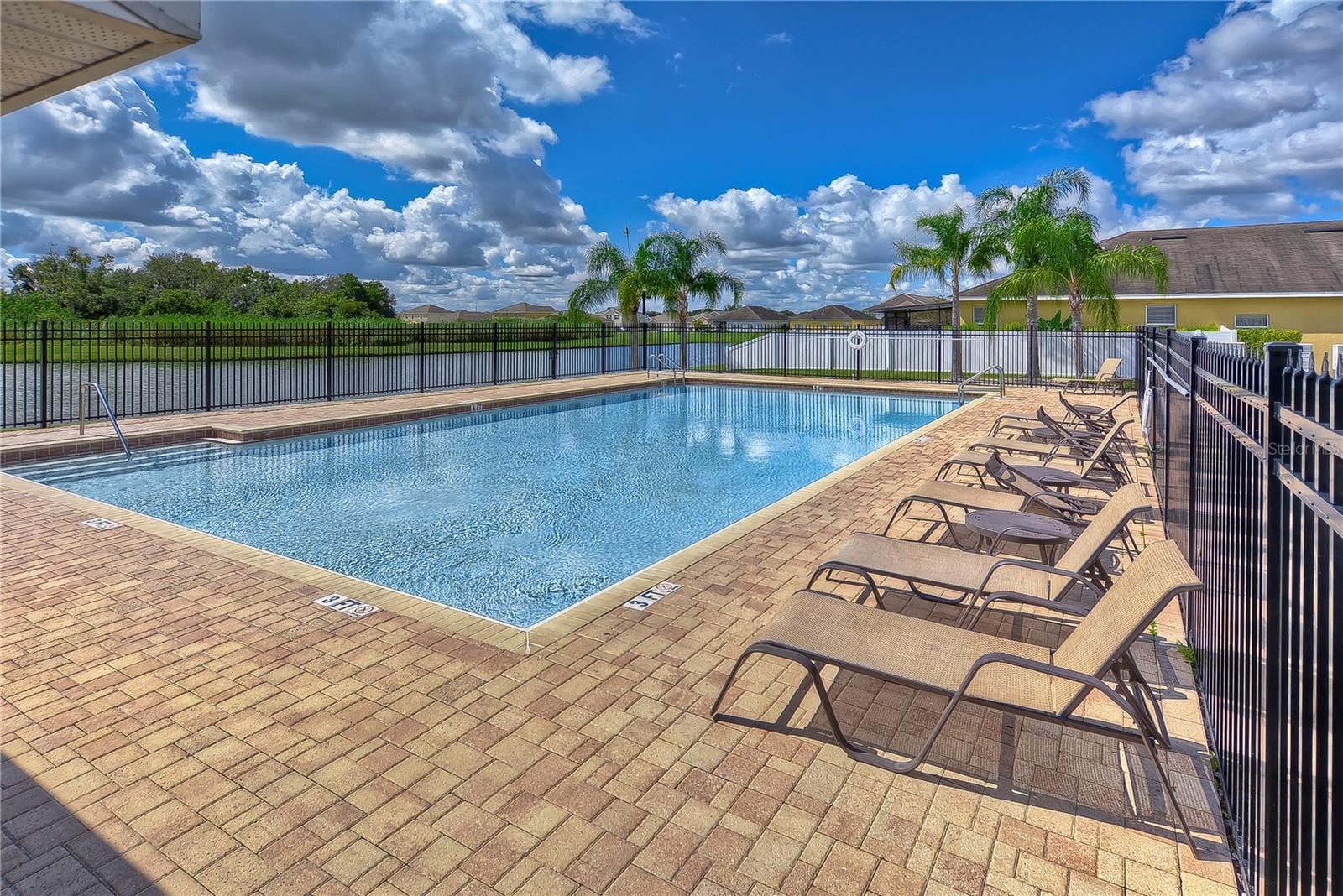 Summer is here and you are in luck, this home is just steps away from the community pool!