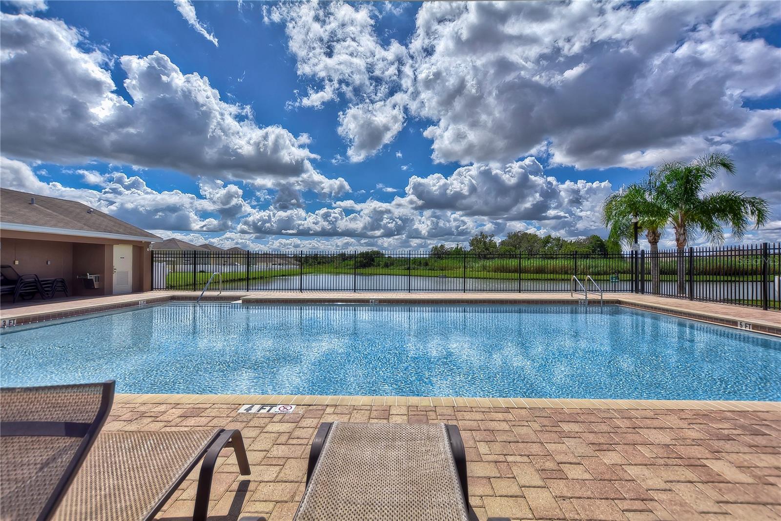 Summer is here and you are in luck, this home is just steps away from the community pool!
