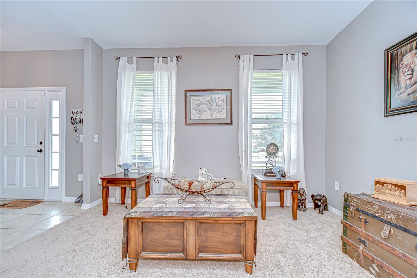 The formal living room is at the front of the home with tons of natural light!