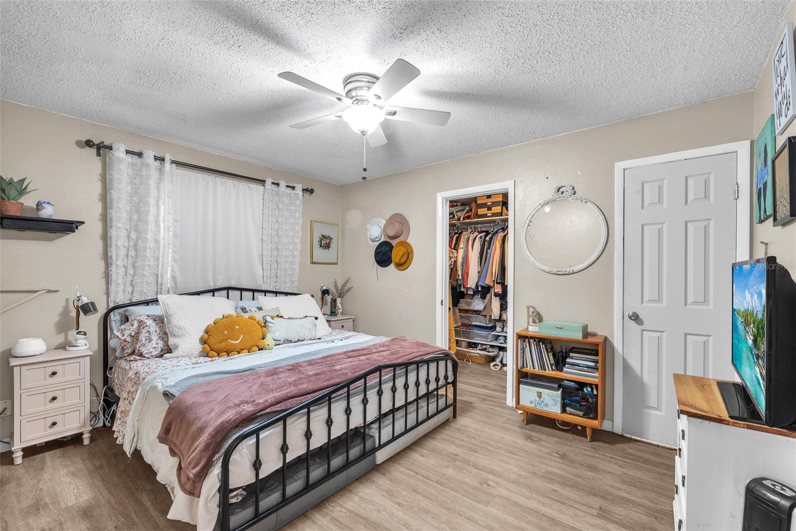 The primary bedroom has a walk-in closet and en-suite bathroom with a single sink and shower (No tub)