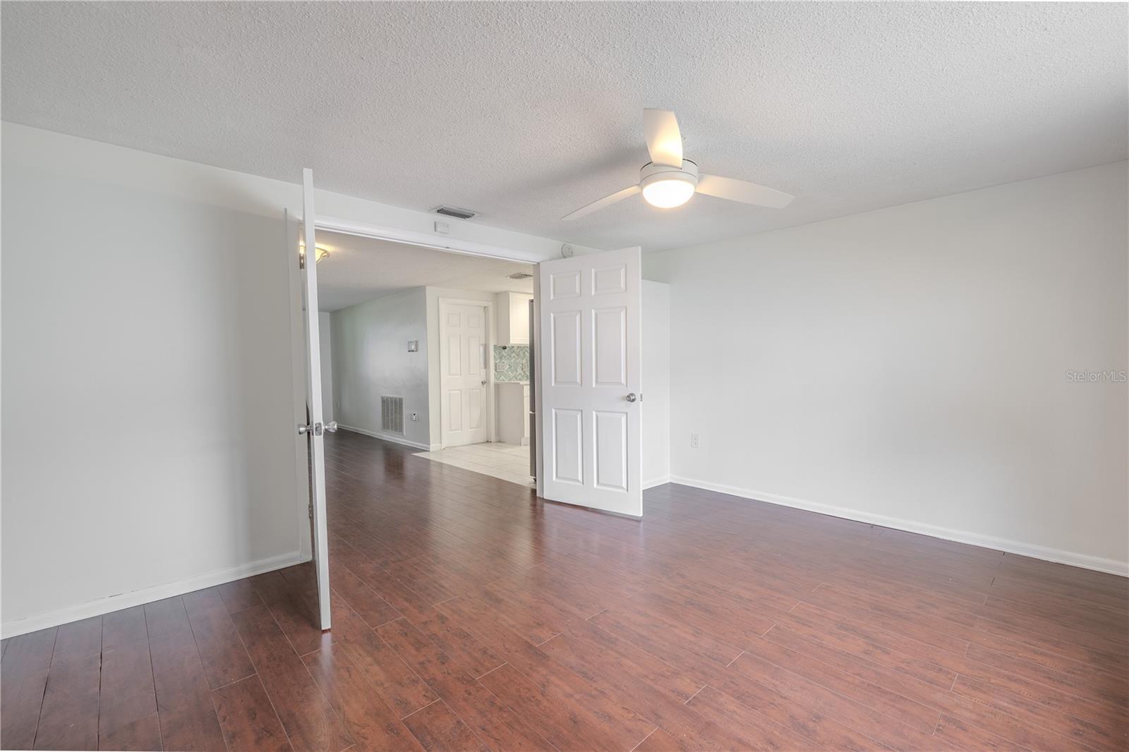 Need extra sleeping space? This flexible bonus room easily serves as a third bedroom. With double-door entry, a ceiling fan, and a generous layout, it’s ready to welcome guests or function as a more permanent solution for multigenerational living. Just add a closet system or wardrobe and you're set.
