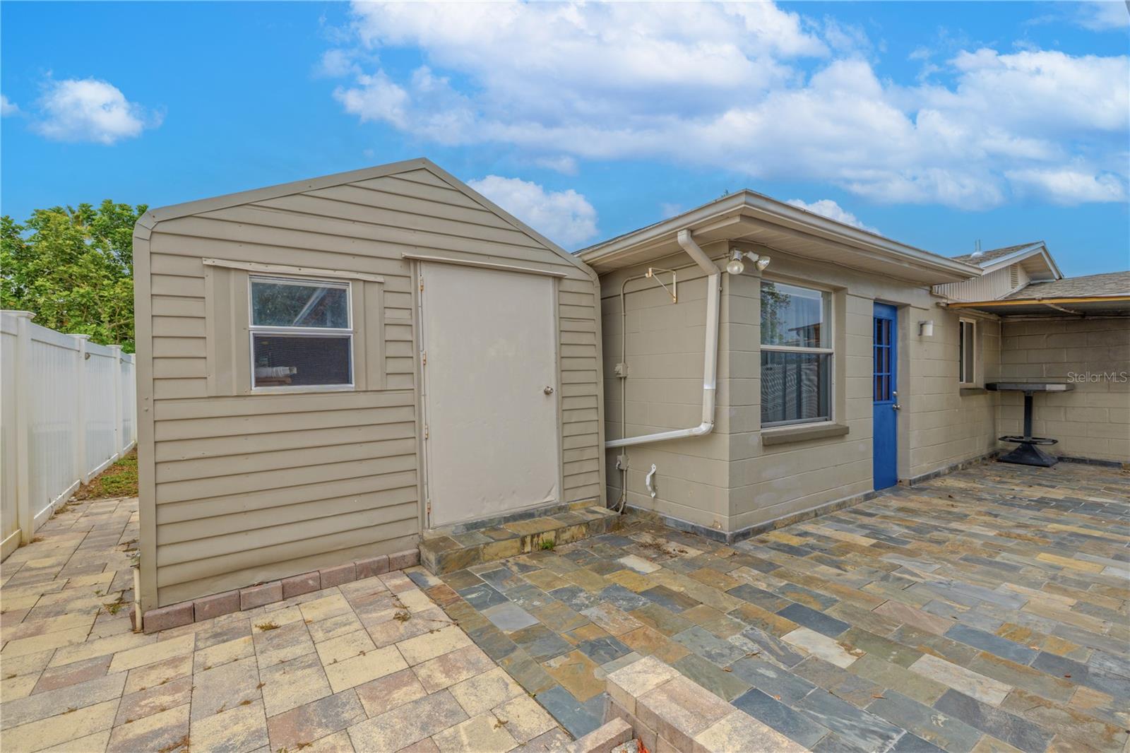 Need extra space for hobbies, tools, or weekend projects? This dedicated storage shed is a functional bonus with endless potential. Located just off the back patio, it features a full-size entry door, its own window, and an air conditioning unit to keep things cool while you work or store heat-sensitive items.