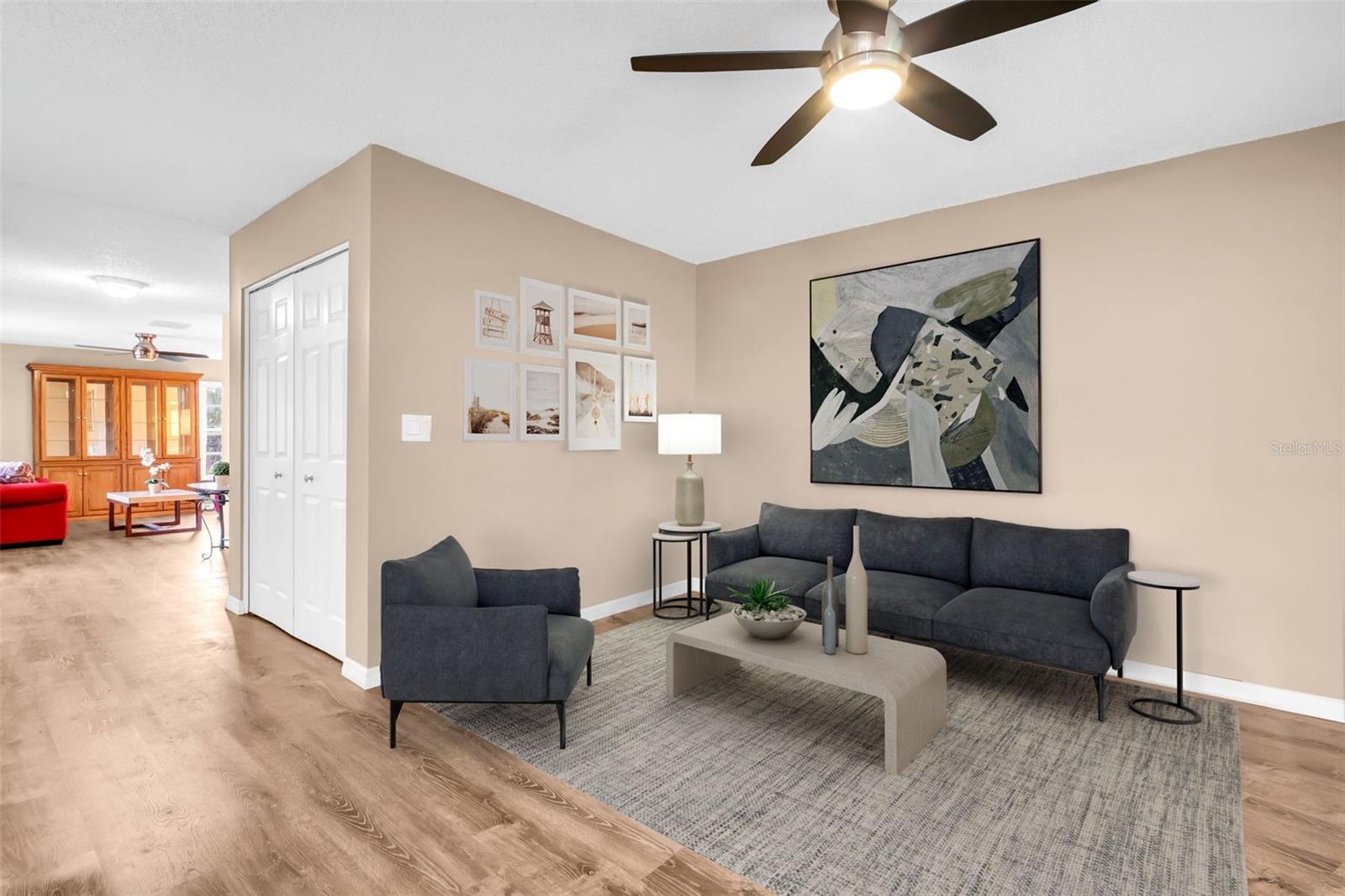 Living room off the kitchen with slider access to private screened lanai~