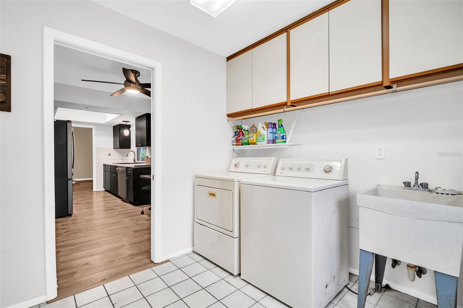 Large indoor laundry plus utility sink with garage access~