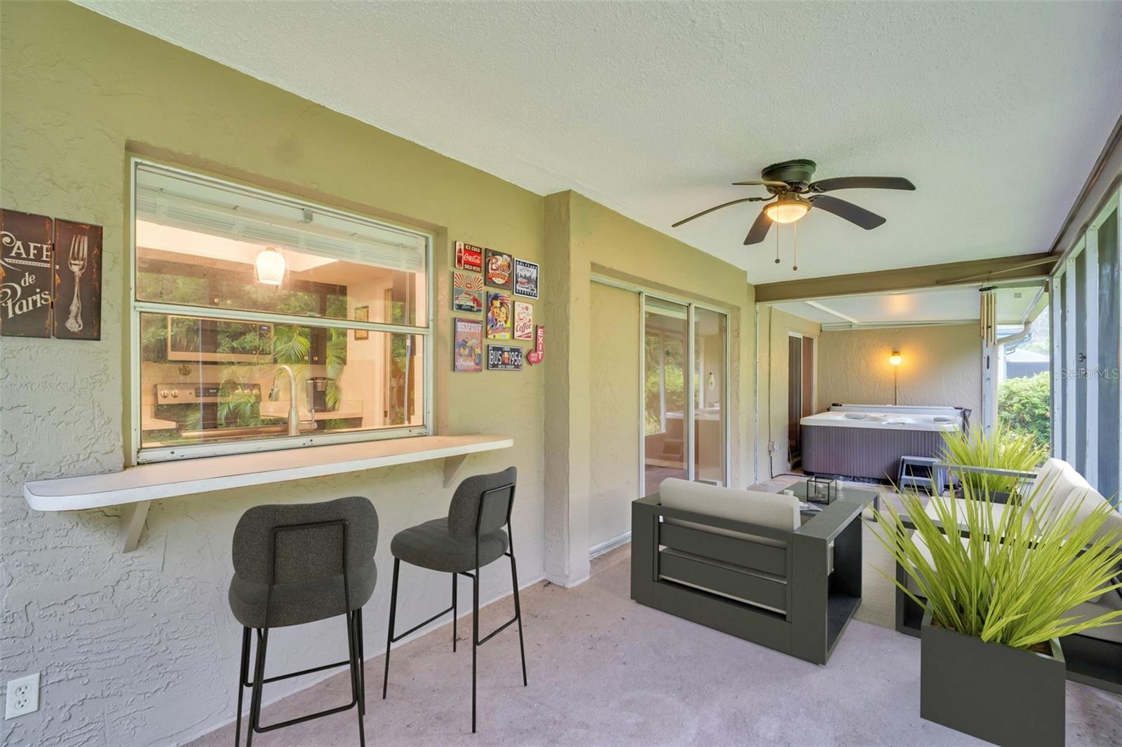 Bar top space off the kitchen passthrough window to easily enjoy the outdoor scenery & relaxing dips into your new hot tub~