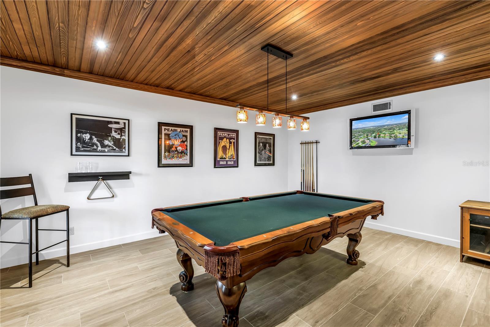 Recreation, gaming or pool table room at front of home, adjacent and open to Dining