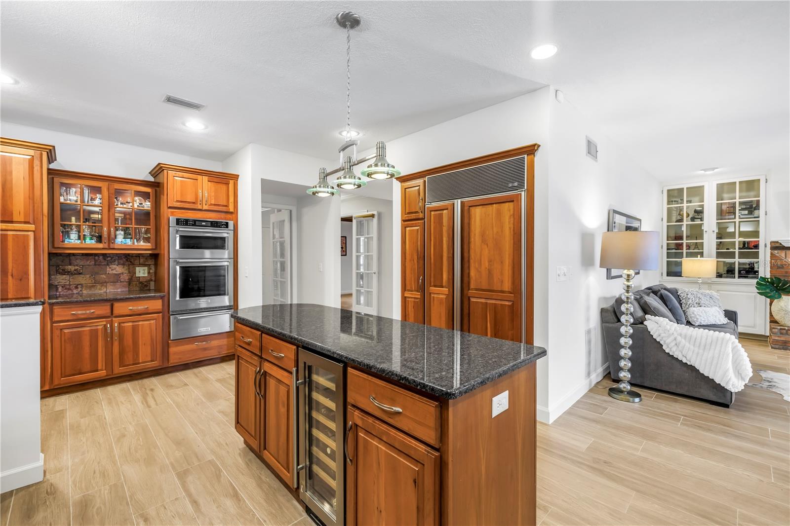 Wine fridge and wall ovens with warming drawer