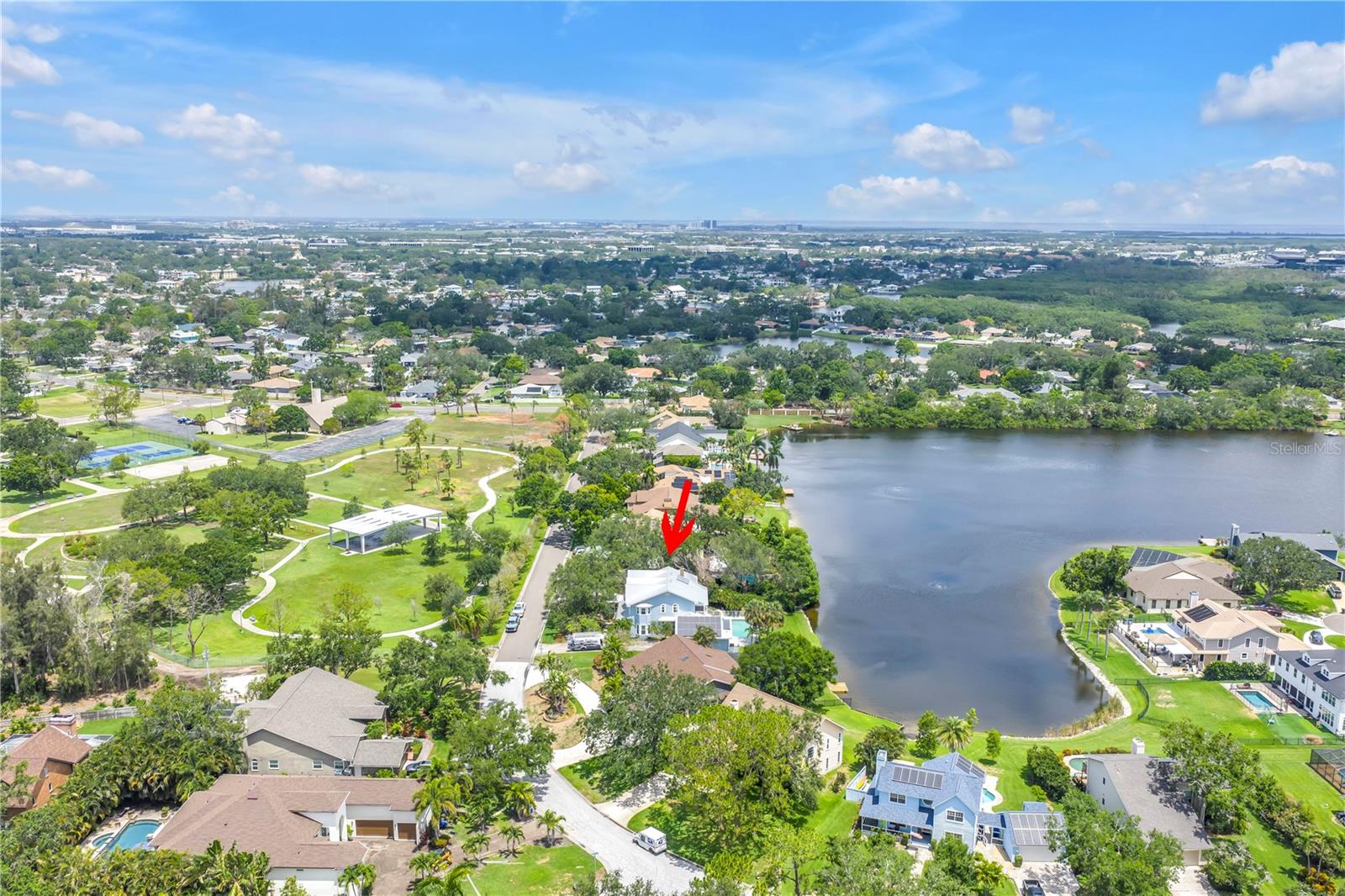 Park Includes Pavilion, walking paths, tennis and pickleball courts, workout area