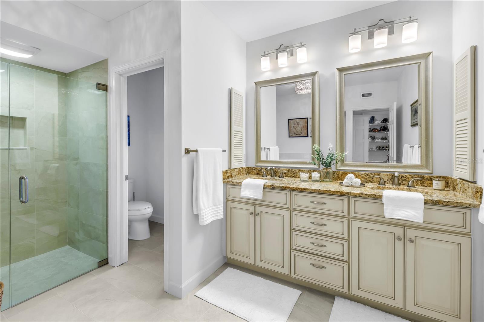 Primary Bath with new Flooring and updated Dual Vanity