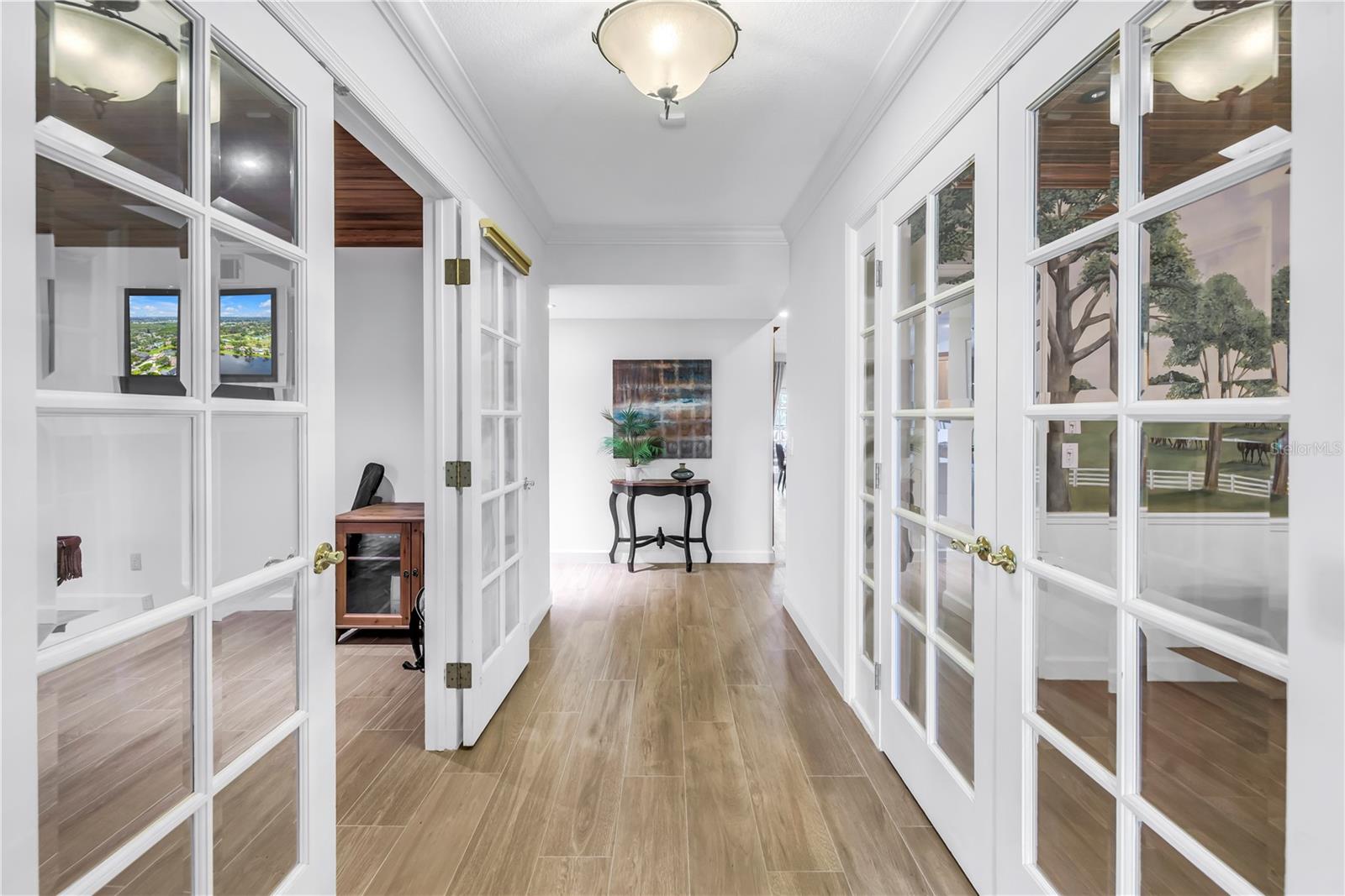 Beautiful entry to the home.  with glass doors and large rec and dining space