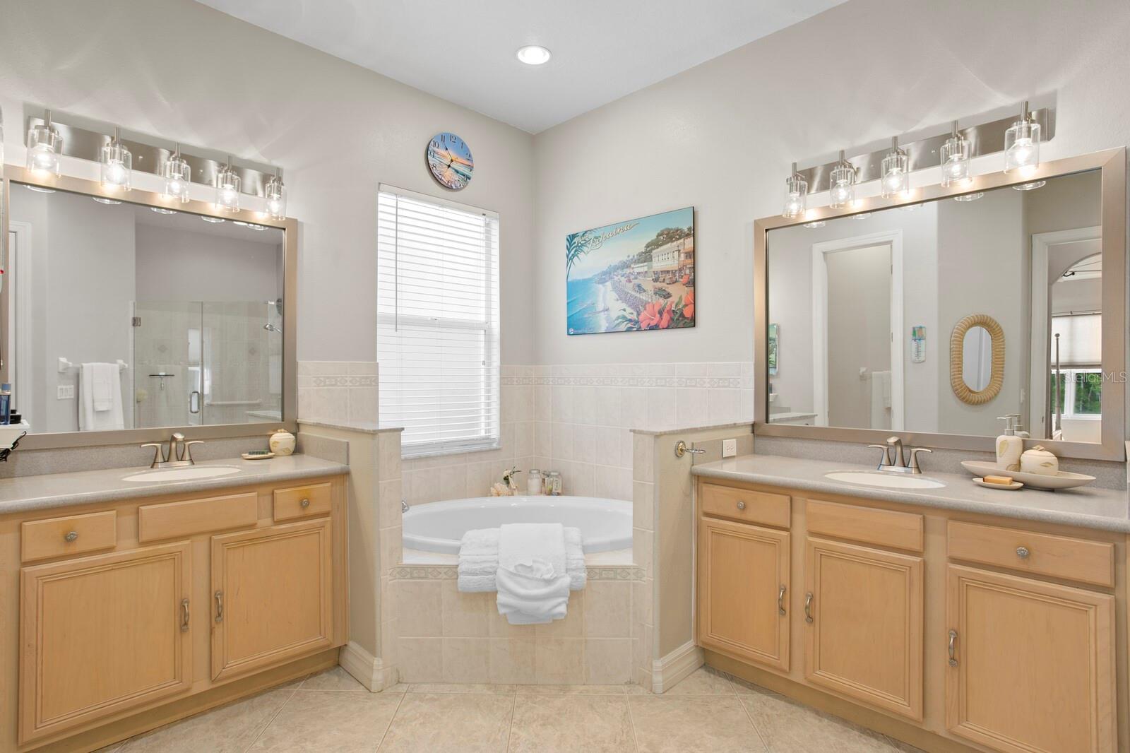 Primary bath with jetted tub and two vanities