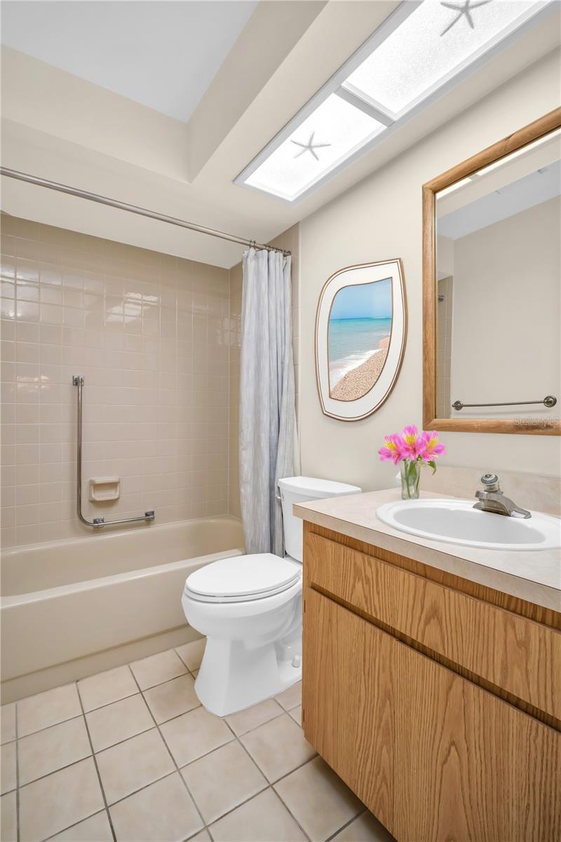 Hall bath perfectly tucked between main living & guest suite~