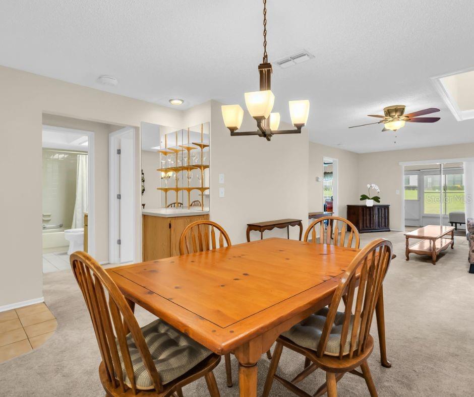 Guest suite, hall bath, and inside laundry privately tucked at front of home~