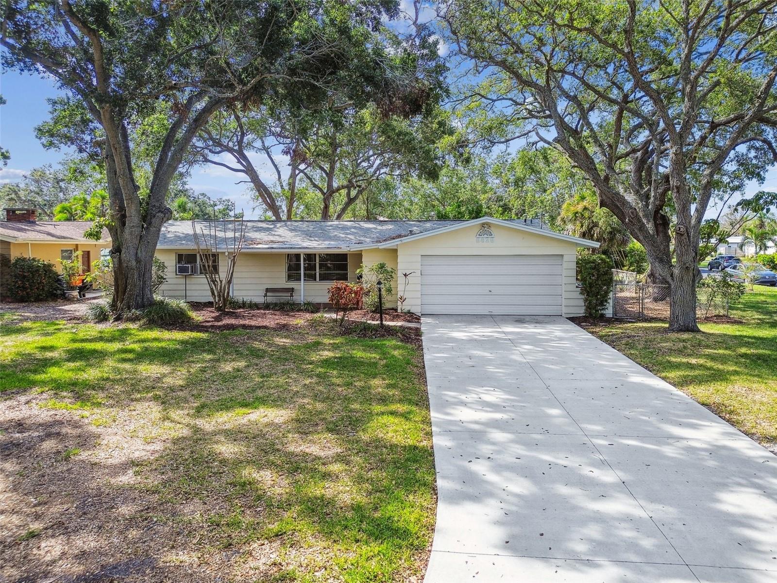Spacious covered front porch. Plenty of parking space, shady lot