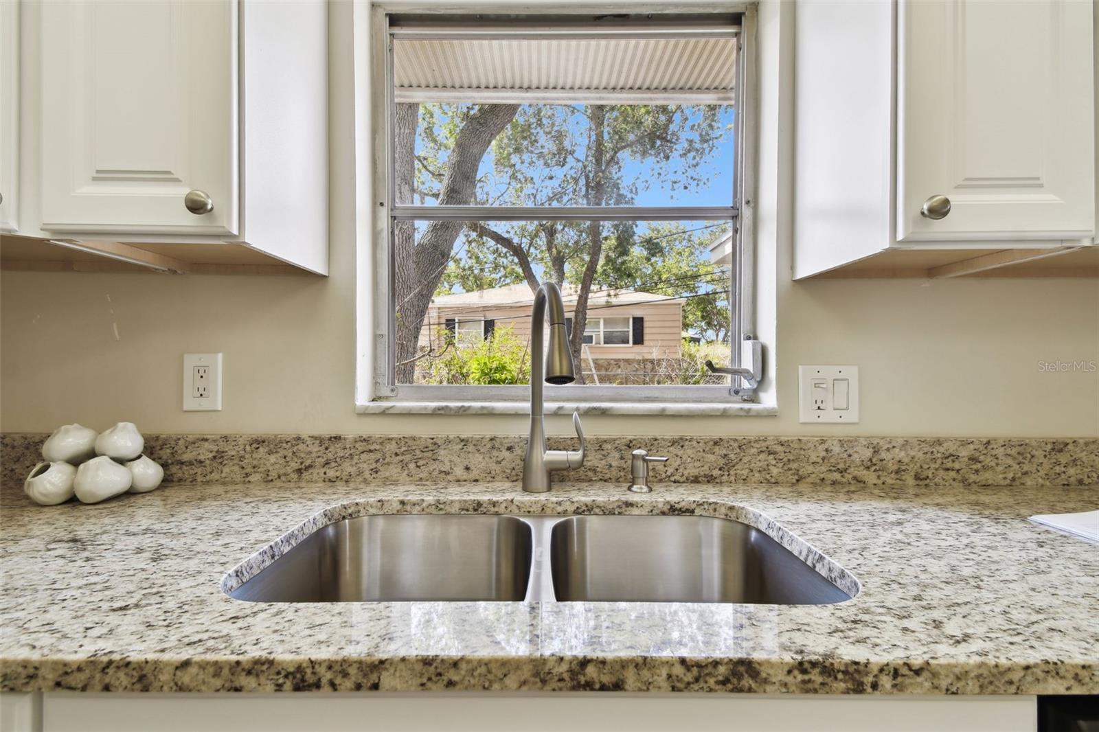 Everybody loves a kitchen window, for daydreaming while washing dishes