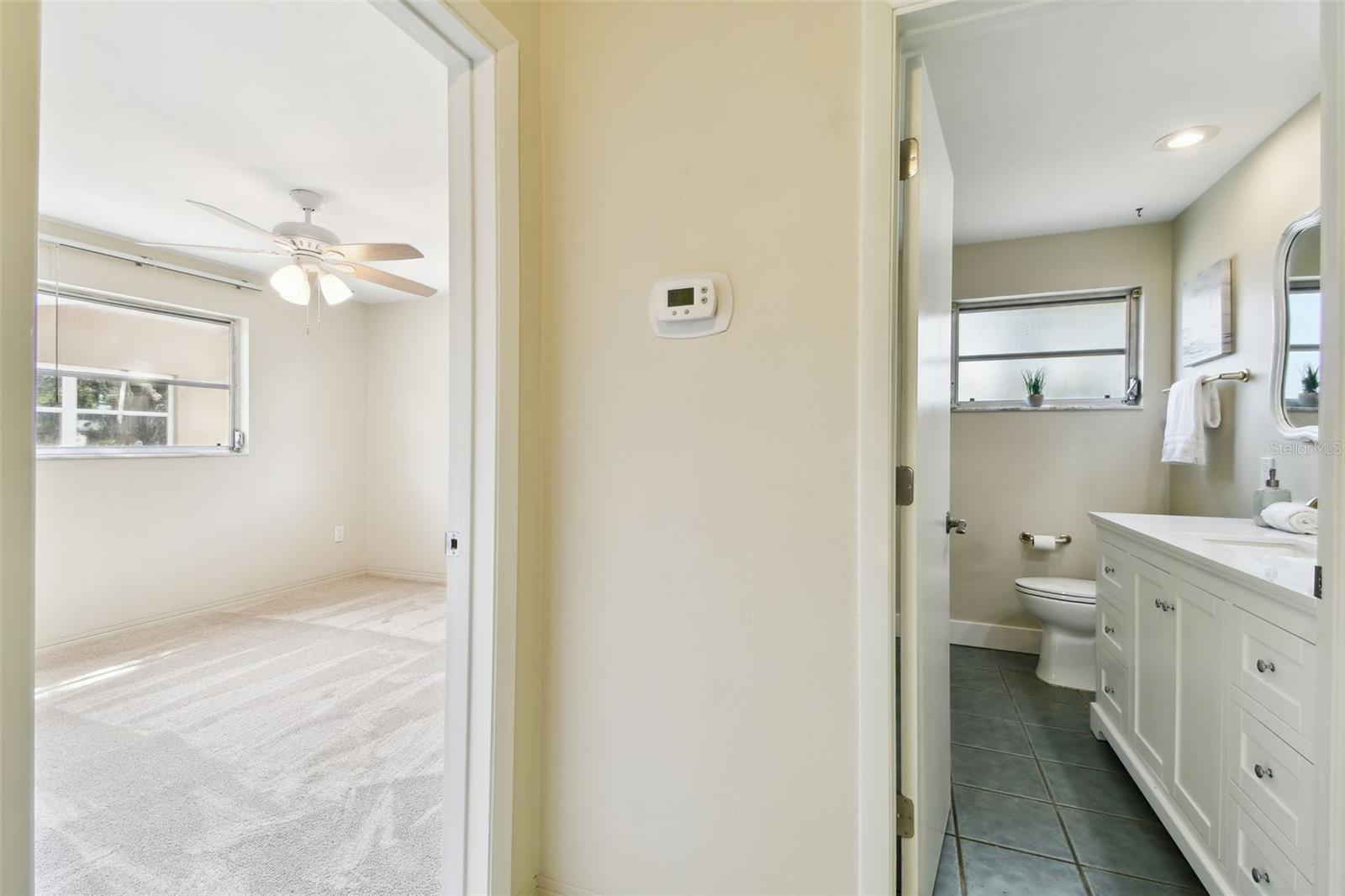 Hall bathroom, with tub, tall vanity so that you don't have to bend over