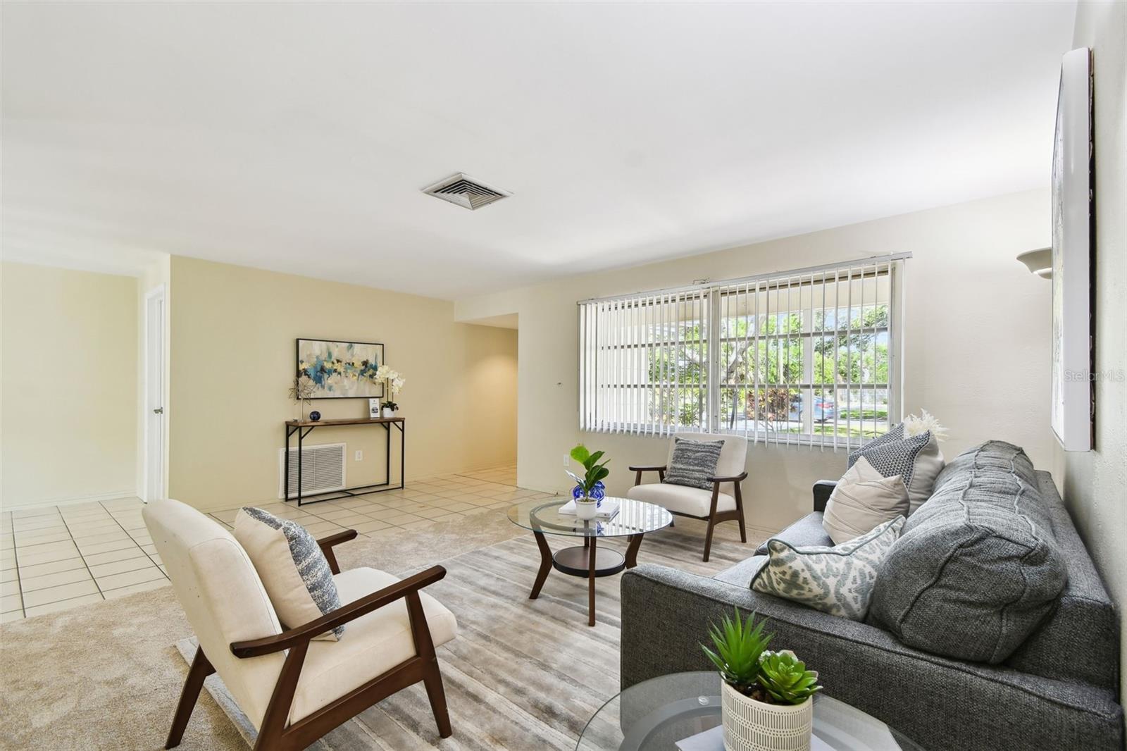 Tiled Foyer entry with coat closet. Then into this lovely bright Living Room. New carpet