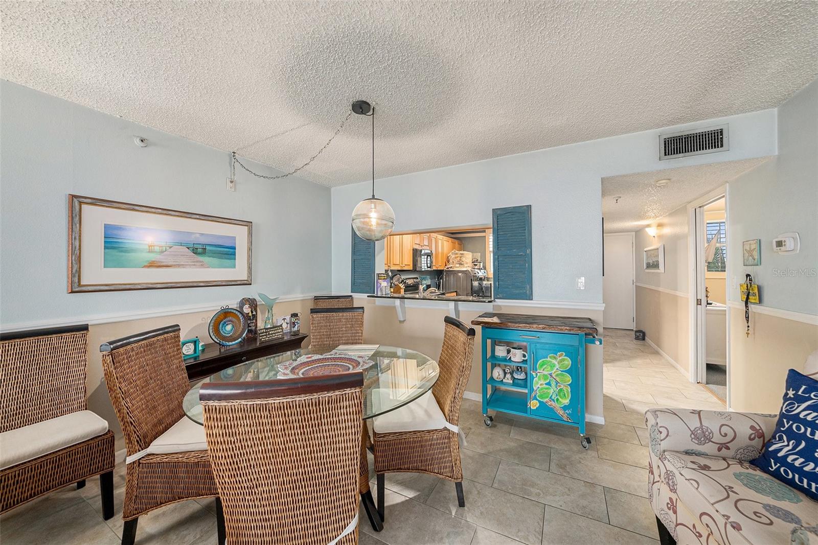 Gorgeous Porcelain tile from entry/kitchen/dining and through the living room.