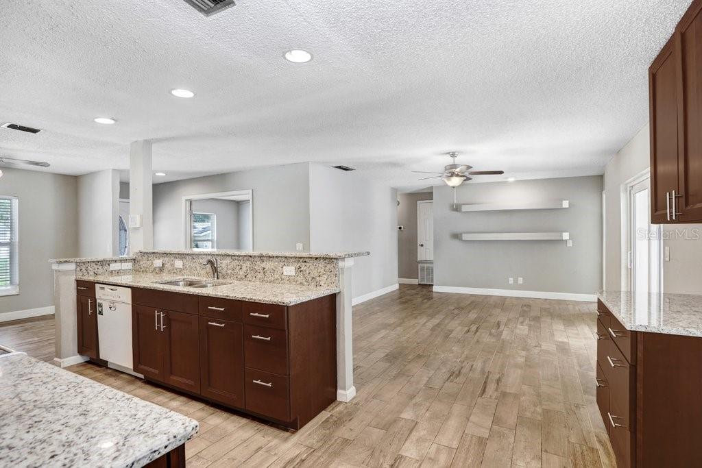 Kitchen with beautiful 42 inch cabinets, granite countertops and beautiful backsplash