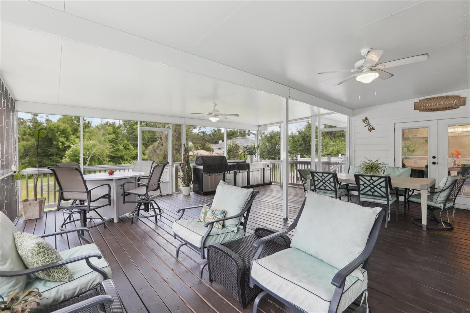 Back screened patio overlooking the landscaped yard, pool and nature preserve.