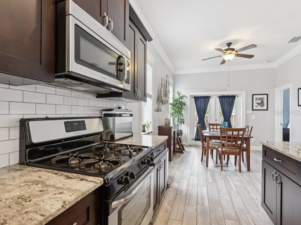 Kitchen with gas stove.
