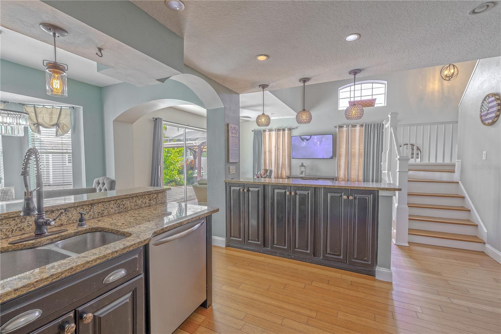Bamboo flooring continues throughout the space, adding warmth and cohesion.