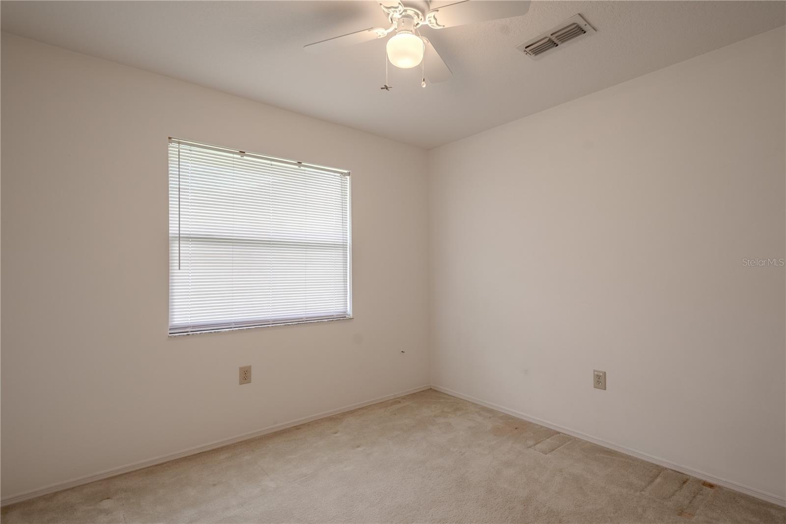 The 4h bedroom includes a ceiling fan, deep closet, and soft natural light.
