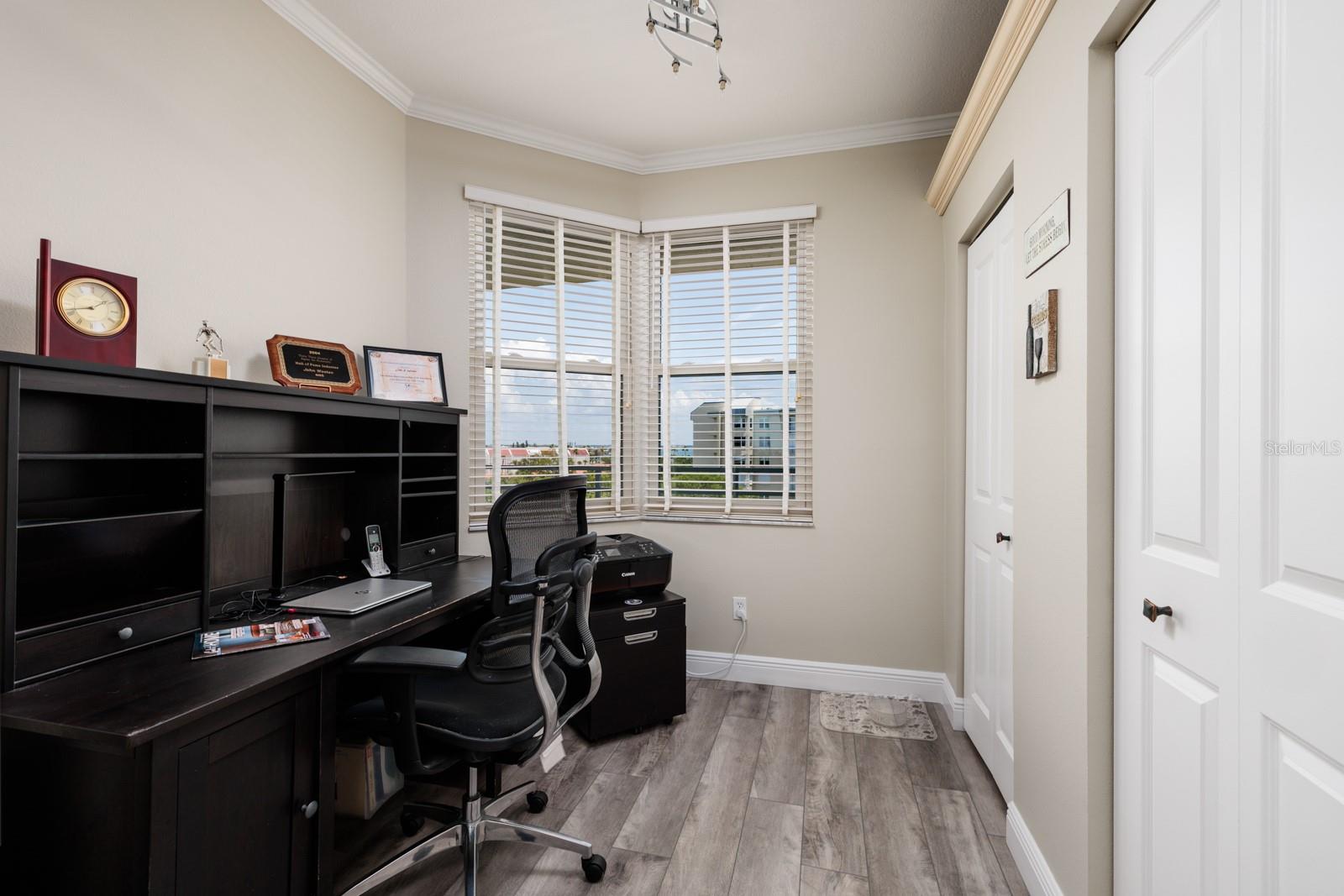 Breakfast nook used as an office. Note: Two closet pantries