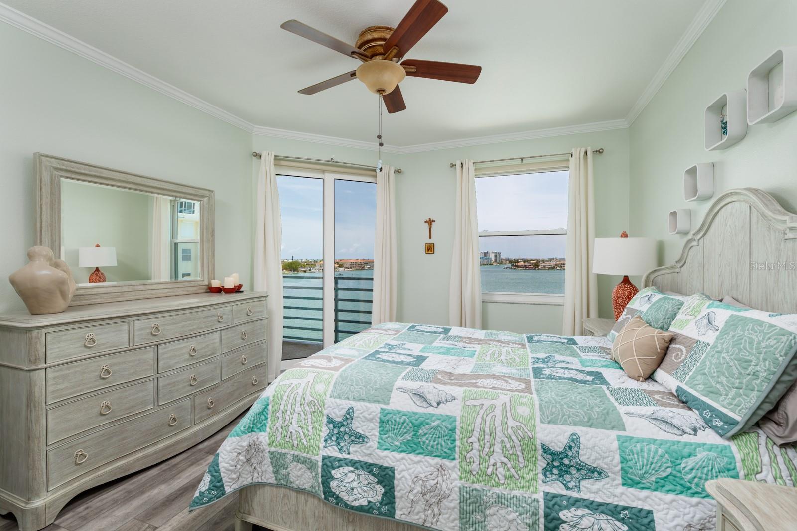 Primary bedroom with lovely views and balcony access.